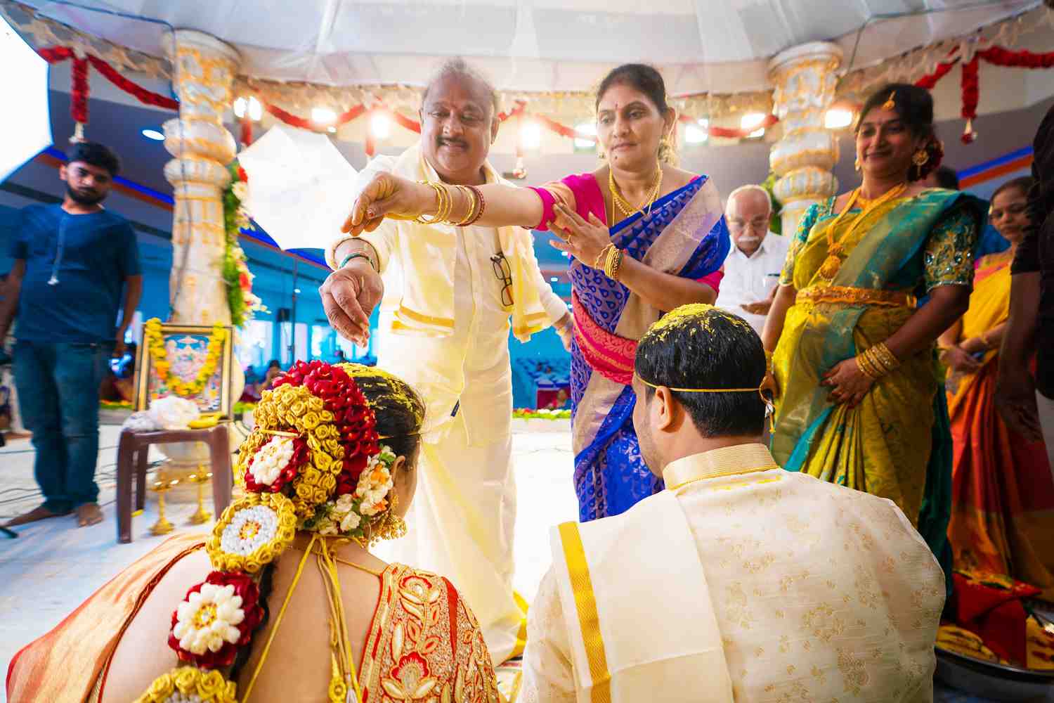 Indian parents blessing their child's love marriage with traditional ceremonies, showing family harmony and acceptance achieved through astrological guidance
